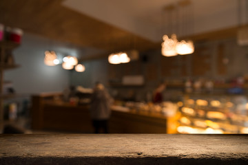 blurred background of bar and dark brown desk space of retro wood