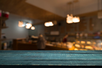 blurred background of bar and dark brown desk space of retro wood