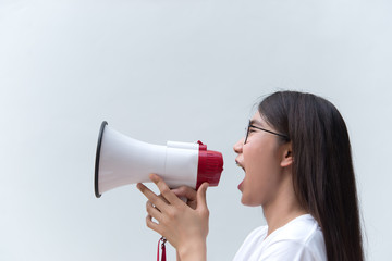 Beautiful asian woman with speaker in hand on white background,angry woman concept,Thailand people