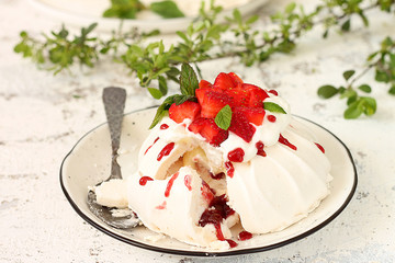 Pavlova dessert with strawberries on top 