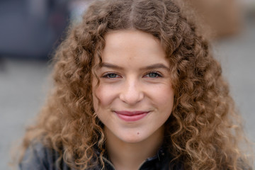 Close up of happy woman with curly hair