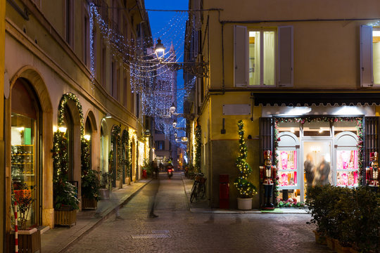 View on lanes with Christmas illumination in night Parma of Italy