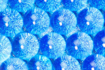 sparkles translucent through blue hydrogel
