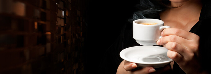 Woman's Hands holding a cup of coffee