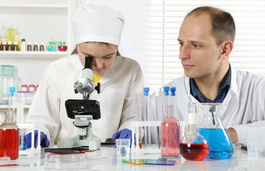 A young scientist conducts classes in biochemistry