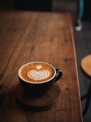 coffee latte on the wood desk in cafe