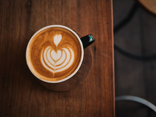 coffee latte on the wood desk in cafe