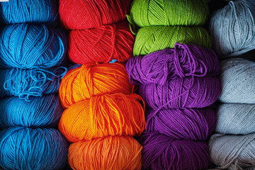 Knitting accessories. Colorful colorful skeins of yarn. Storage. Multicolored yarns.