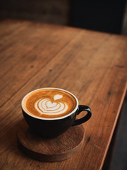 coffee latte on the wood desk in cafe