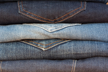 Naklejka premium Jeans stack, Background fashion jeans.