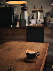 coffee latte on the wood desk in cafe