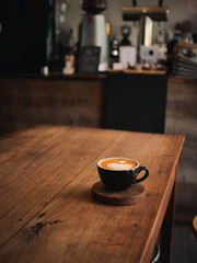 coffee latte on the wood desk in cafe