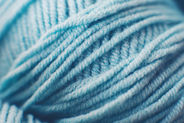 Fototapeta na wymiar Macro blue ball of yarn. Fibers. Background. Blur