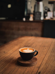 Obraz na płótnie Canvas coffee latte on the wood desk in cafe