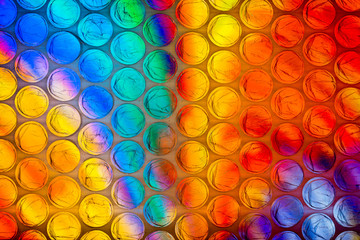 Abstract textured background of a colorful sheet of plastic bubble wrap