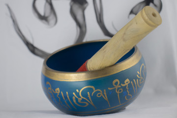 Hand Crafted bronze Singing Bowl painted in Blue and Gold color, often used for meditation
