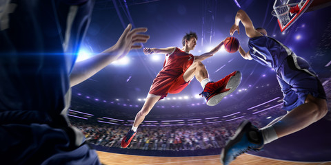 Basketball player make block shot in jump. around Arena with blue light spot