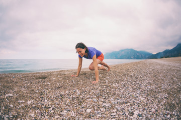 Fototapeta na wymiar Woman doing sports on the beach.