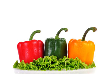 Set of three peppers on white background. Yellow, red and green