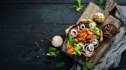 Marinated mushrooms with onions and spices in a plate. on rustic background, top view, banner.