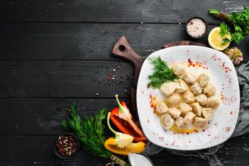 Ravioli with meat. Dumplings Top view. Free space for your text. Rustic style.