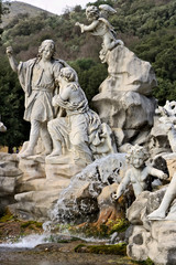 Fototapeta na wymiar Reggia di Caserta, Italy. 10/27/2018. Fountain with sculptures in white marble