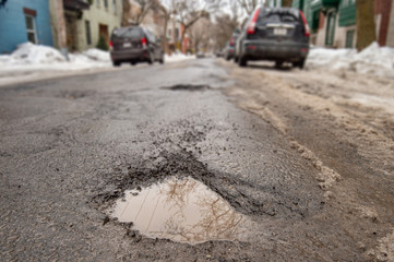 Large pothole in Montreal street, Canada.