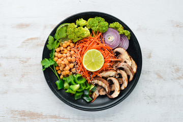 Vegan breakfast meal in bowl with Mushrooms, Turkish Pea, and Vegetables. Top view. Free space for your text.