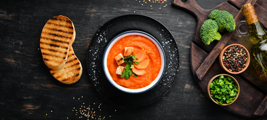 Carrot puree soup. with toast bread. Dietary food. Top view. Free copy space.