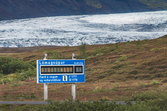 Board with road information in Iceland at summer
