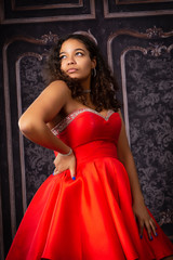 Beautiful,  Biracial High School Senior wearing red prom dress © Mary Perry