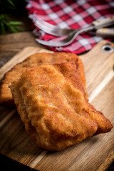 Two fried cod fillet pieces.