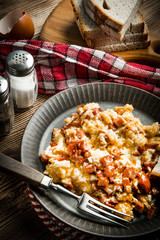 Scrambled eggs with sausage.