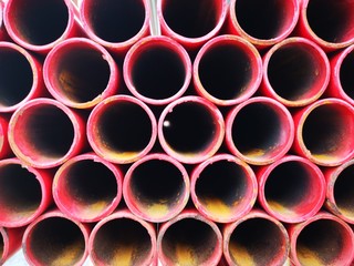 stacked iron pipes