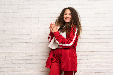 Teenager sport girl with curly hair scheming something