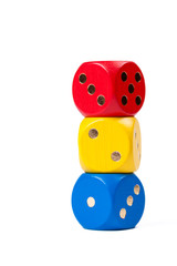 Three colorful dices in primary colors stacked on each other isolated on white background showing numbers one, two, three. Red, Yellow, Blue. Tower of cubes in basic colours, school education concept.