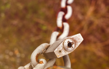 rusty padlock on chain
