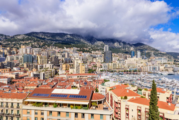 Fototapeta premium Cityscape and harbor of Monte Carlo. Aerial view of Monaco on a Sunny day, Monte Carlo, Principality of Monaco