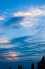 Landscape with dramatic light - beautiful golden sunset with saturated sky and clouds.