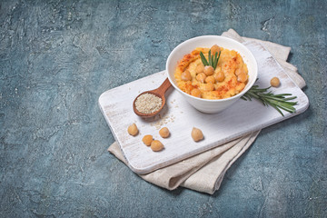 Traditional homemade chickpea hummus snack with spice of rosemary
