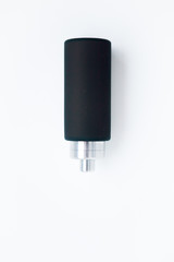 Black silicone bottle on the white background, close up