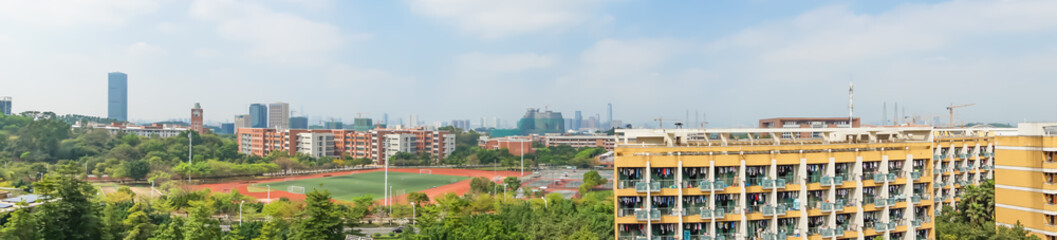 Panoramic view of  football field and domitory