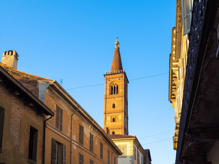 Fototapeta na wymiar apartment houses and bell bell tower in Pavia city