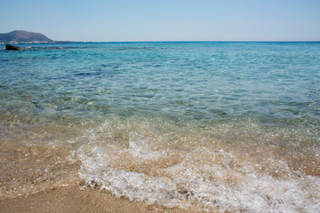 Falasarna beach, Crete Island landmark. Paradise beach with turquoise water and pink sand, Greece