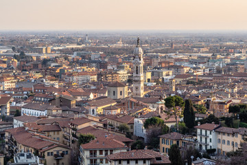 Naklejka premium above view of Lower Town of Bergamo city at sunset