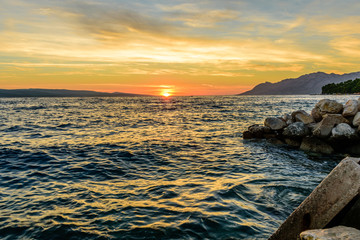 Beautiful sunset at the sea. Tourist village Baška Voda, Dalmatia region, Croatia