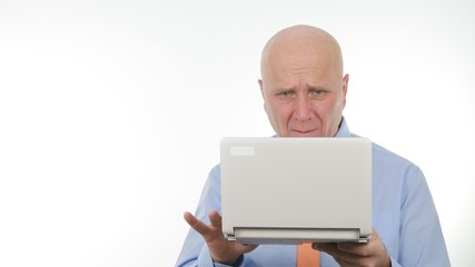 Disappointed Businessman Read Bad News on Laptop and Make Nervous Hand Gestures