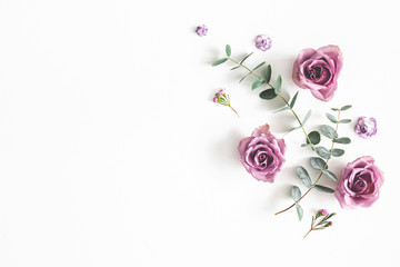 Flowers composition. Pattern made of eucalyptus branches and rose flowers on white background. Flat lay, top view, copy space - obrazy, fototapety, plakaty