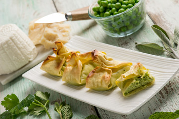 fagottini filled with ricotta parmesan cheese and green peas