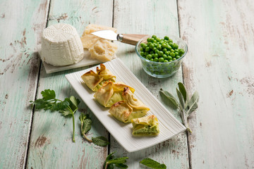fagottini filled with ricotta parmesan cheese and green peas